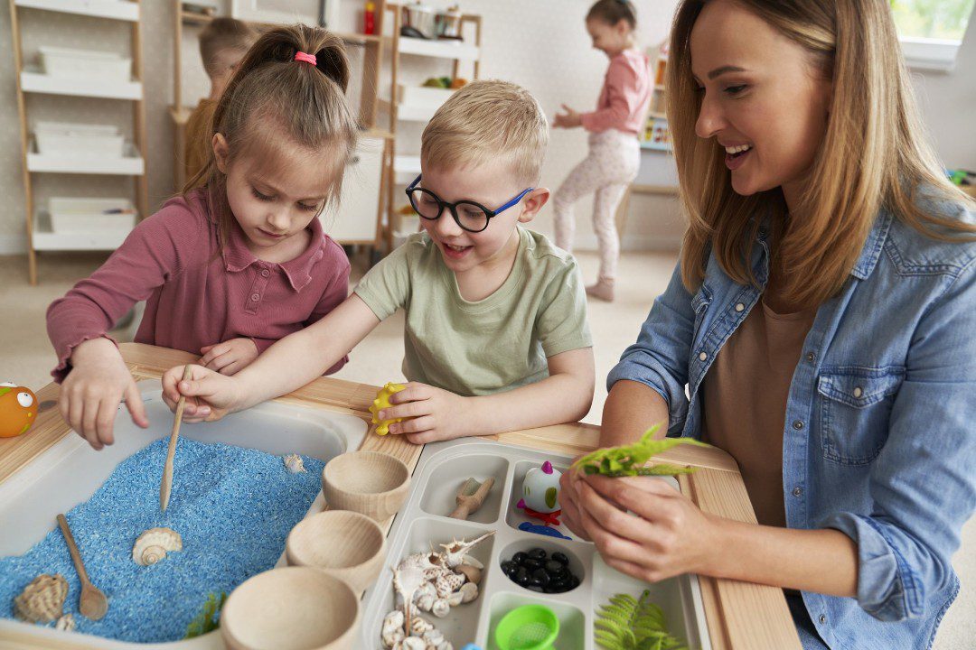Children training fine motor skills with pretend play.