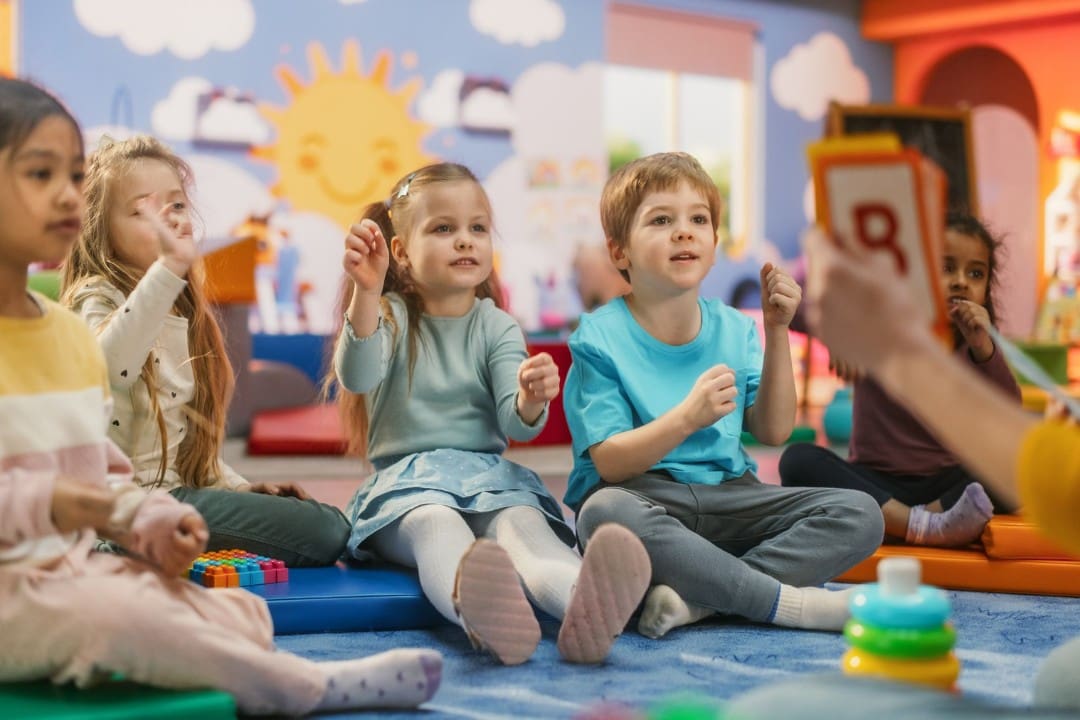 Childcare students in a classroom during storytime