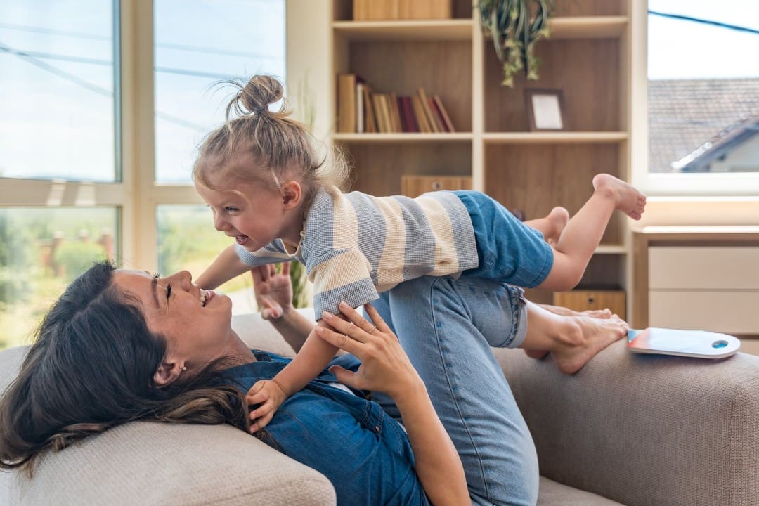 Mother playing with her child to build confidence
