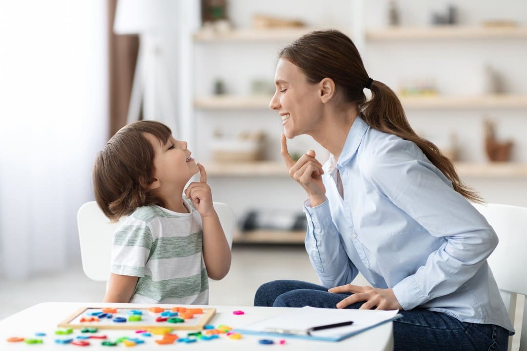 Child receiving early intervention education from teacher
