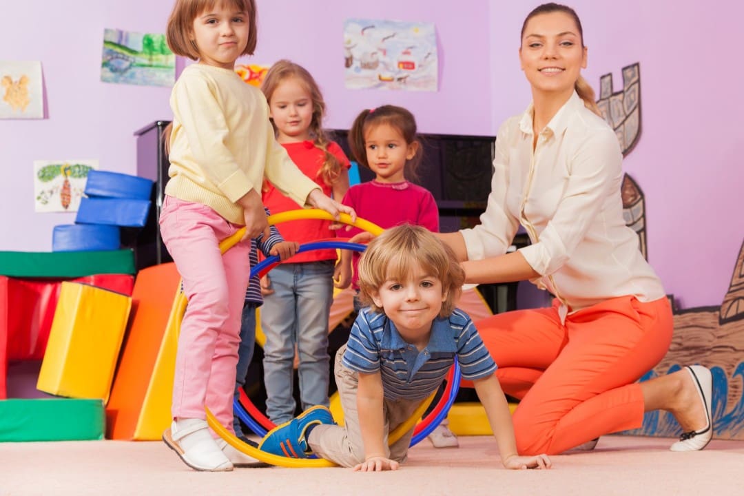 Teacher with kids in a licensed child care center in Minnesota